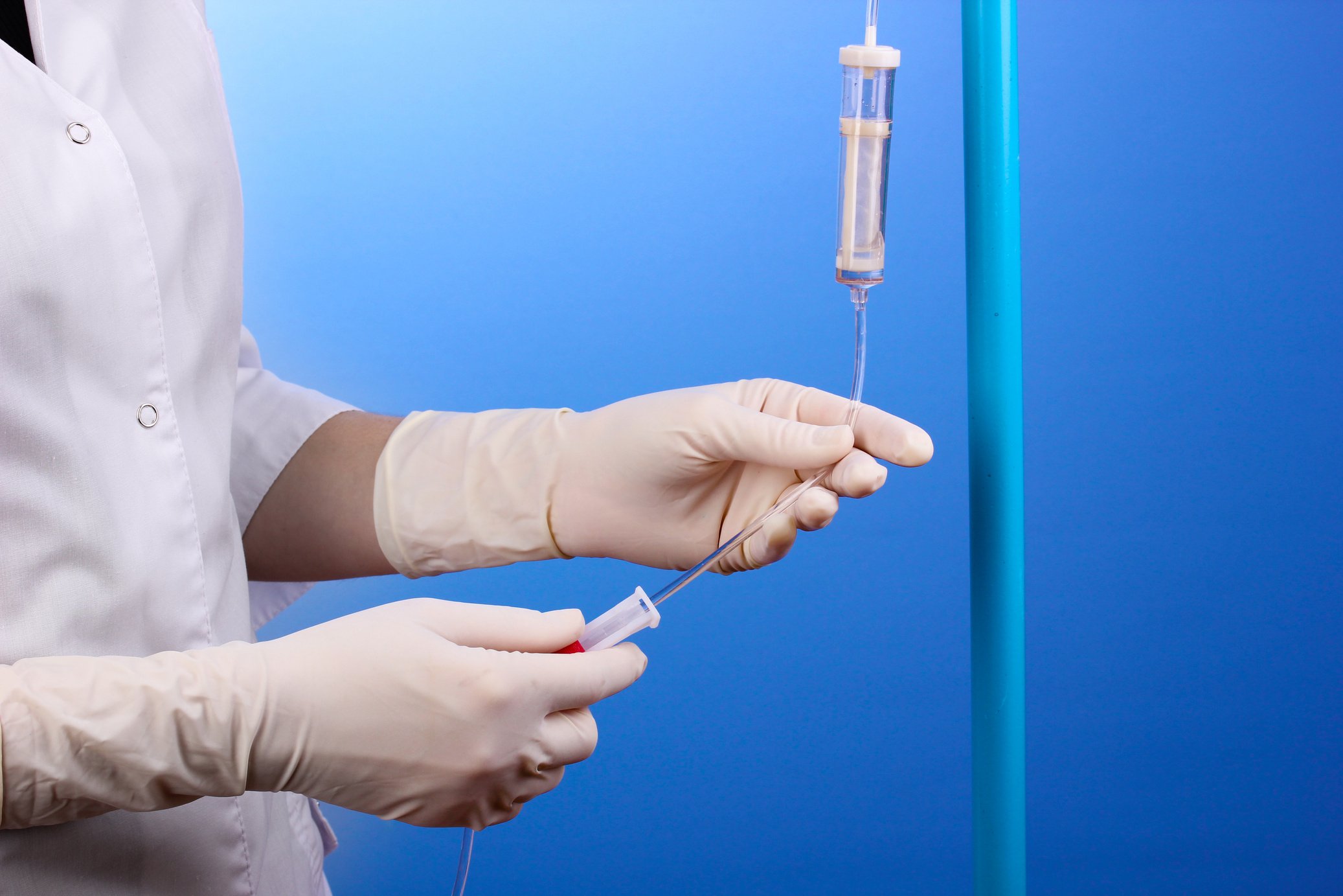 Nurse Doing Infusion on Blue Background